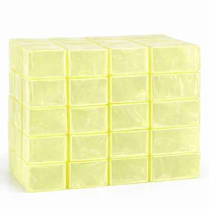 Forty individually wrapped aloe‑colored melt and pour soap base blocks stacked in neat rows, showing their translucent yellow‑green hue and smooth texture for soap making.