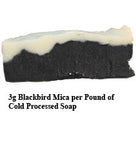 Black mica in cold processed soap with uncolored soap on top