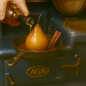 Poached pear in cast iron skillet with cinnamon sticks, brandy being poured over top, set on a deep blue AGA stove. Rich amber sauce pools around the pear, highlighting its glossy caramelized surface.