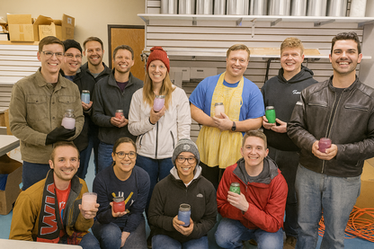 People showing their candles that they made in the fill your own candle making class at Candle Cocoon