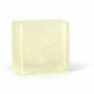 Rectangular block of light yellow clear melt and pour soap base on a white background