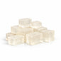 Set of nine white square chopped up clear soap base on a white background