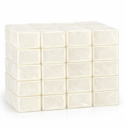 Forty cocoa‑butter melt and pour soap base blocks, individually wrapped and neatly stacked to show their smooth texture and quality for soap making.