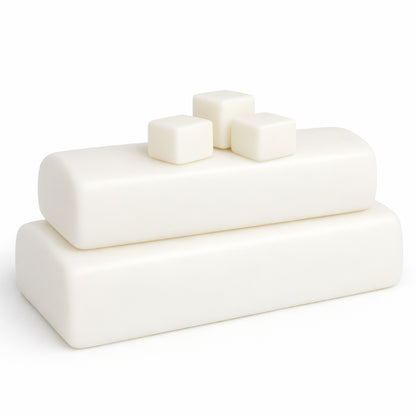 Ten pounds of cocoa‑butter melt and pour soap base shown as smooth, creamy white blocks stacked together to display texture and quality.