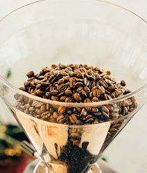 Coffee beans above oil