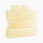 Stack of low sweat SFIC melt and pour soap base bars on a white background