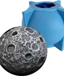 Moon candle with silver aluminum coating next to moon mold