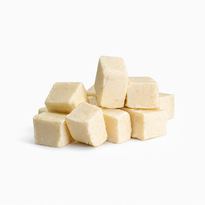 Cream colored Oatmeal Melt and Pour Soap Base cubes of various sized cubes.
