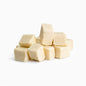 Cream colored Oatmeal Melt and Pour Soap Base cubes of various sized cubes.