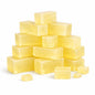 Olive Melt and Pour Soap Base — fourteen translucent golden-yellow rectangular soap blocks stacked in a pyramid formation with a few smaller pieces scattered around the base, all on a clean white background. The smooth, glossy surfaces and soft lighting highlight the soap’s warm, natural translucency.