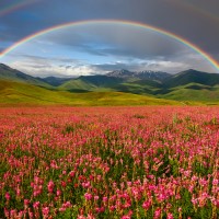 Double rainbow over a peaceful valley