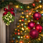A festive Christmas garland decorated with a red satin bow and mistletoe ornament on the left, and shiny red and glittery burgundy tree ornaments on the right, with blurred multicolored holiday lights in the background. Gives the feeling of Tis the Season Fragrance Oil scent.