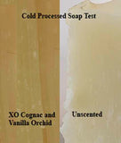 Fragrance added to cold processed soap next to unscented soap to show color differences