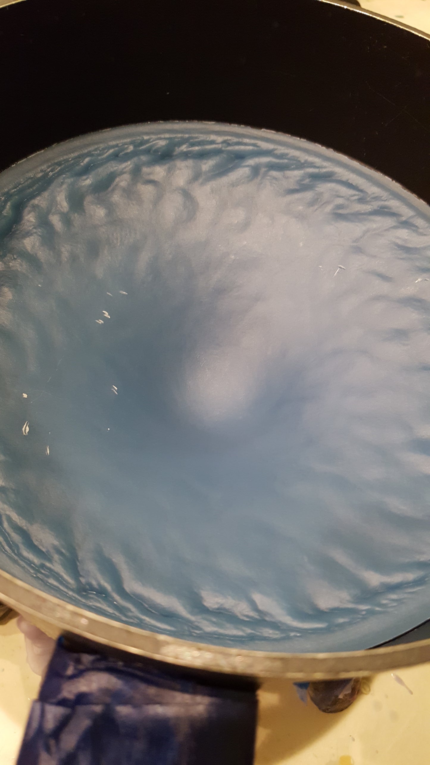 Wavy blue wax resulting from use of too much vybar