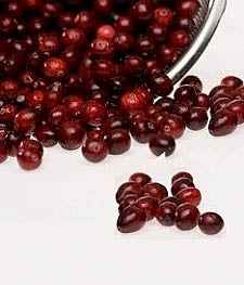 cranberries spilling from a bowl