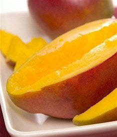 Juicy sliced Mango on a plate to represent Malayan Mango scent